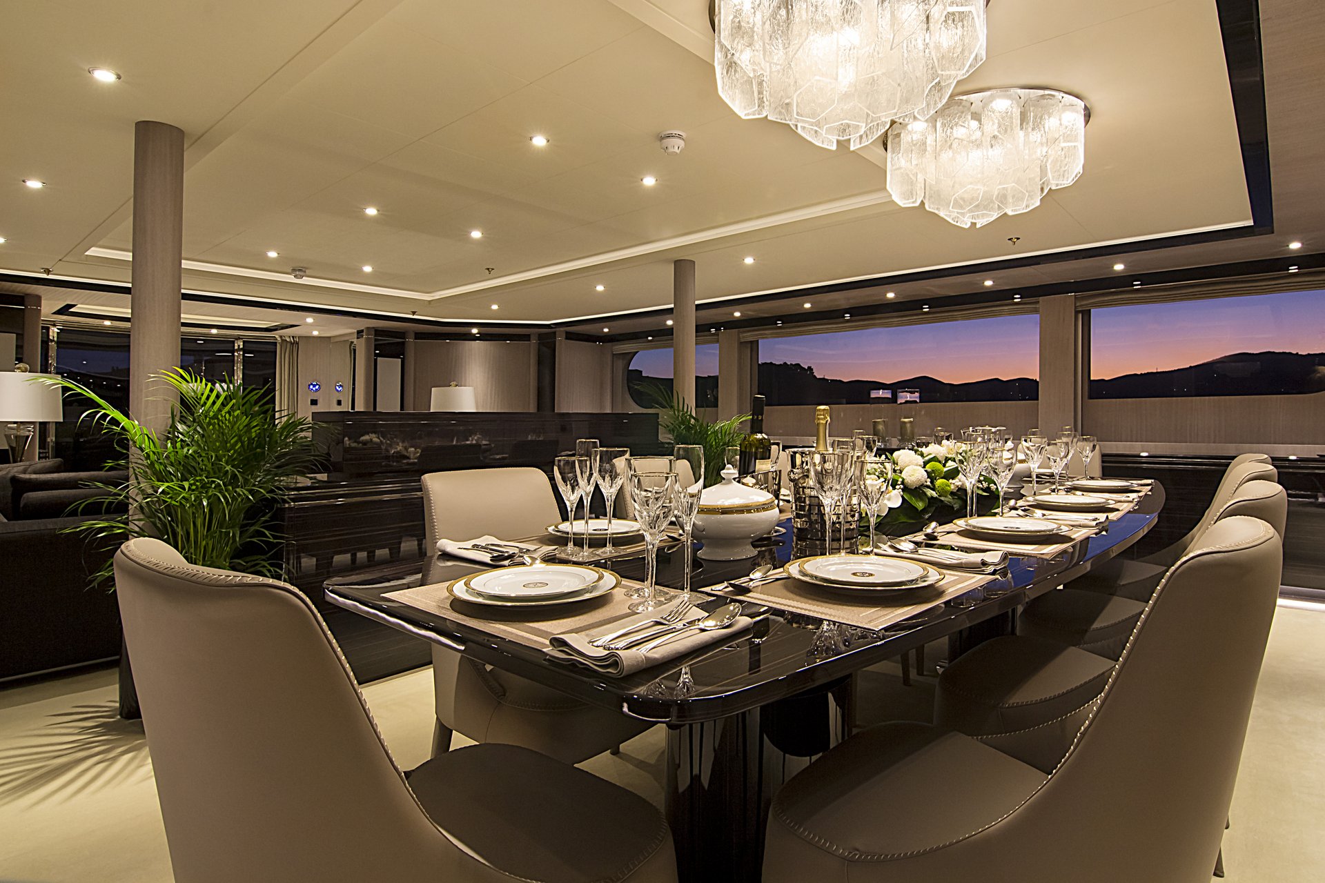 m/y invader yacht for charter set indoor dining table